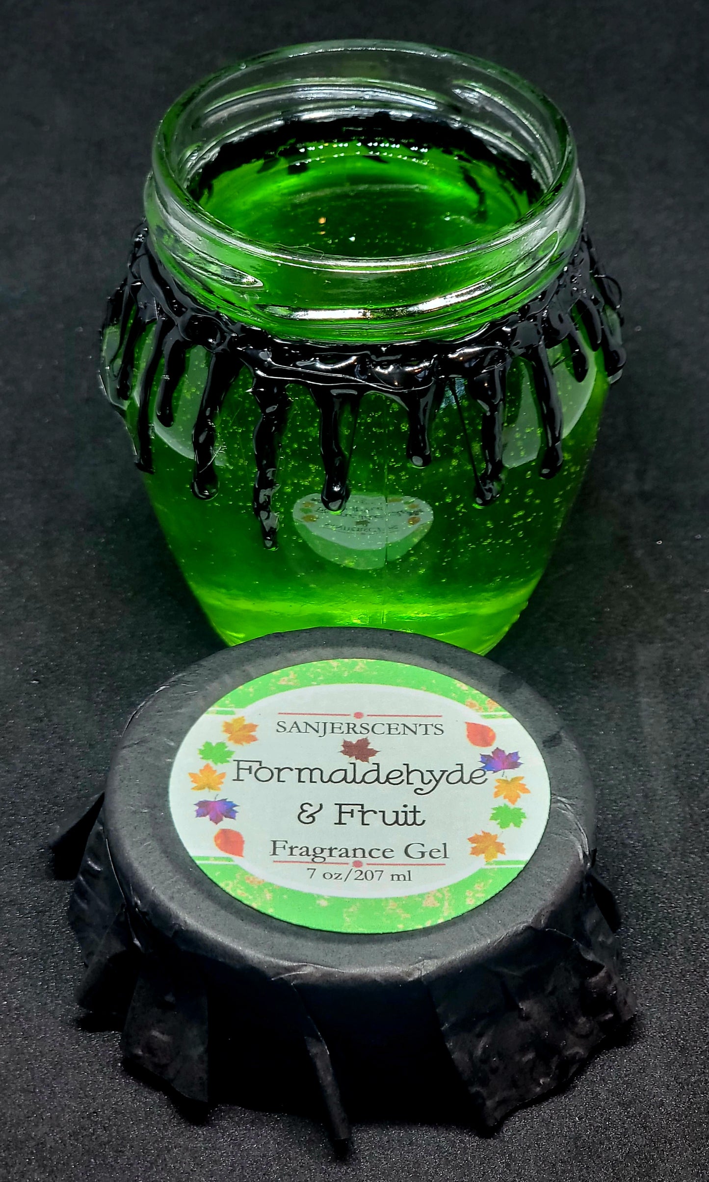 7 oz glass honeypot jar with green Formaldehyde & Fruit fragrance gel. Metal screw top lid with black cover