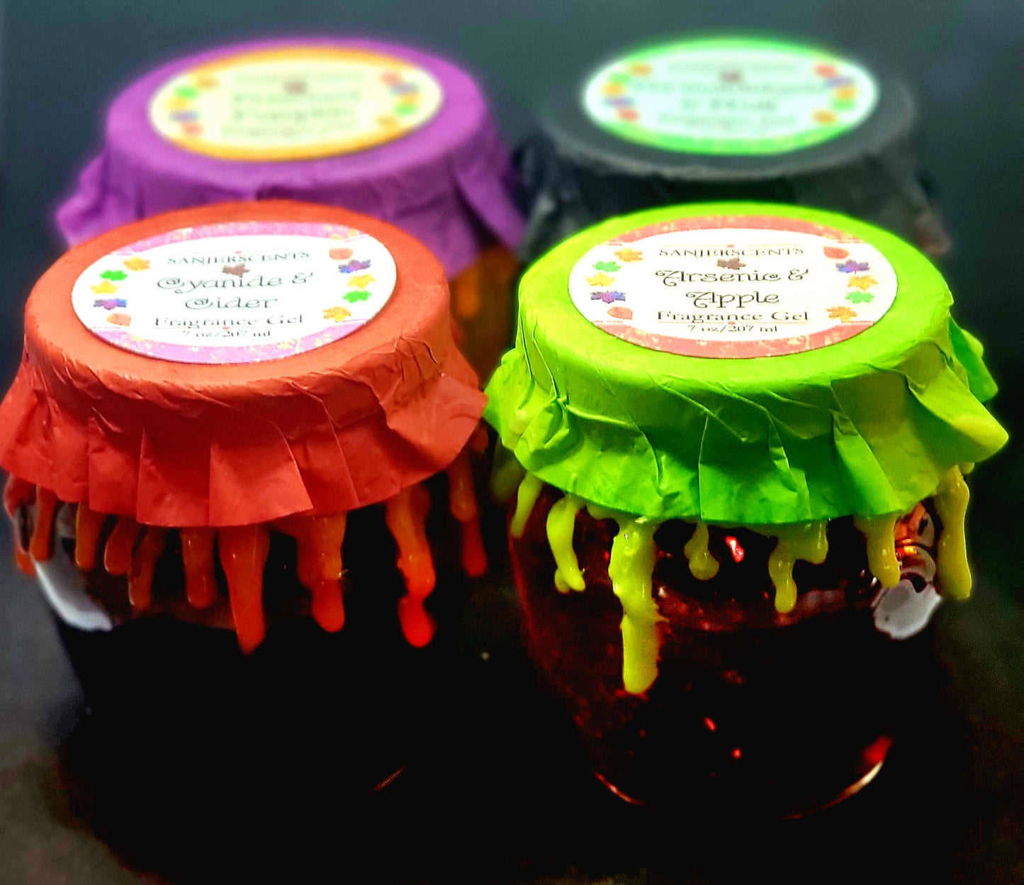 Group of 4 Frightening Fragrance Gels in 7 oz size with metal lids and colorful toppers.