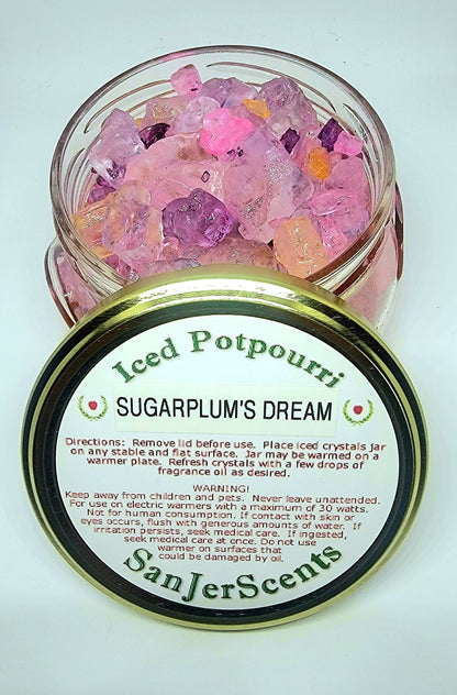 Pink, purple, and gold large rock salt cystal potpourri in Sugar Plum's Dream fragrance.  In a clear glass tureen jar with gold lid.