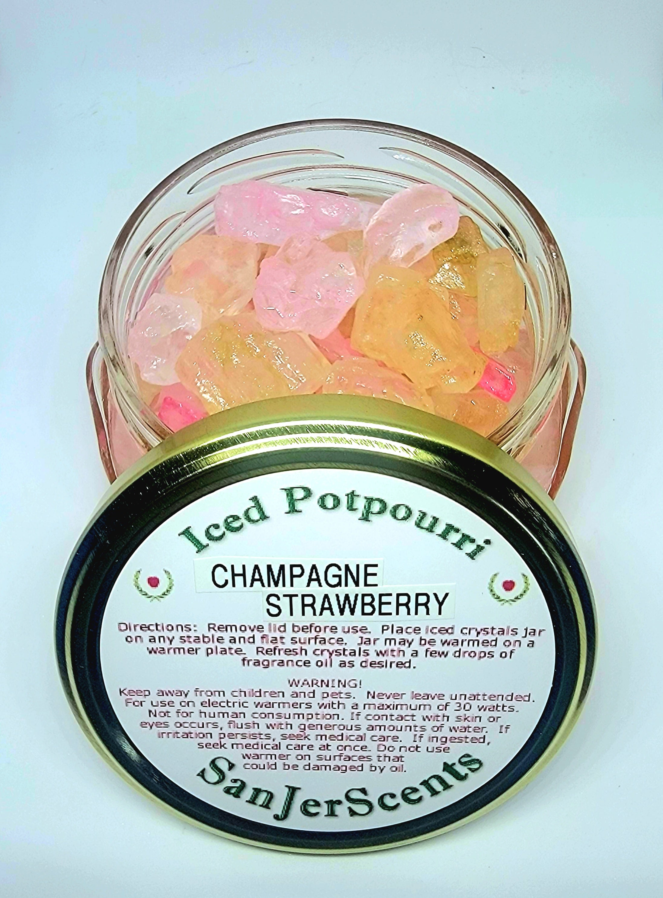 Pink and gold large rock crystal potpourri in Champagne & Strawberry fragrance.  In a clear glass tureen jar with gold lid.