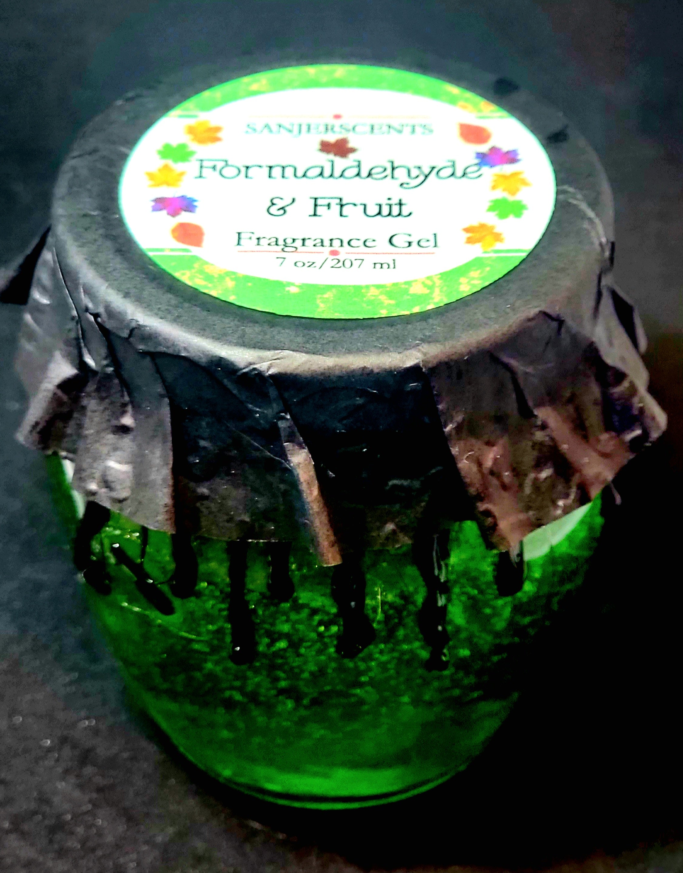 7 oz glass honeypot jar with green Formaldehyde & Fruit fragrance gel.  Metal screw top lid with black cover