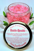 Pink large rock crystal potpourri in Barbie Sparkle fragrance.  In clear glass tureen with instructions for use on gold metal lid.