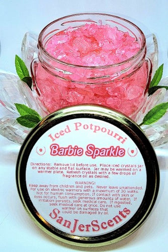 Pink large rock crystal potpourri in Barbie Sparkle fragrance.  In clear glass tureen with instructions for use on gold metal lid.